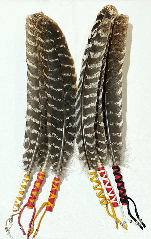 TURKEY FEATHERS WRAPPED IN LEATHER